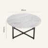 White marble effect round coffee table with black metal legs, 85cm diameter.