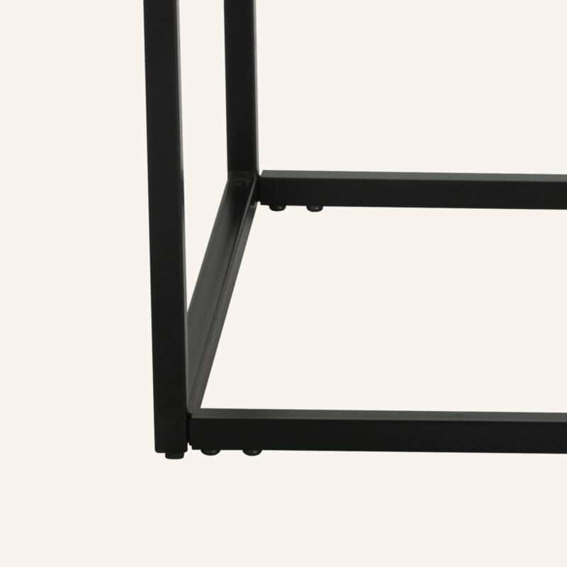 Close-up of black metal frame of industrial style coffee table.
