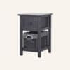 Grey bedside table with wicker basket and storage drawer for bedroom decor.