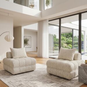 Modern living room with two cream-coloured armchairs and large glass windows.