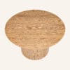 Luxe wooden round coffee table with ribbed base from Dreamo Living.