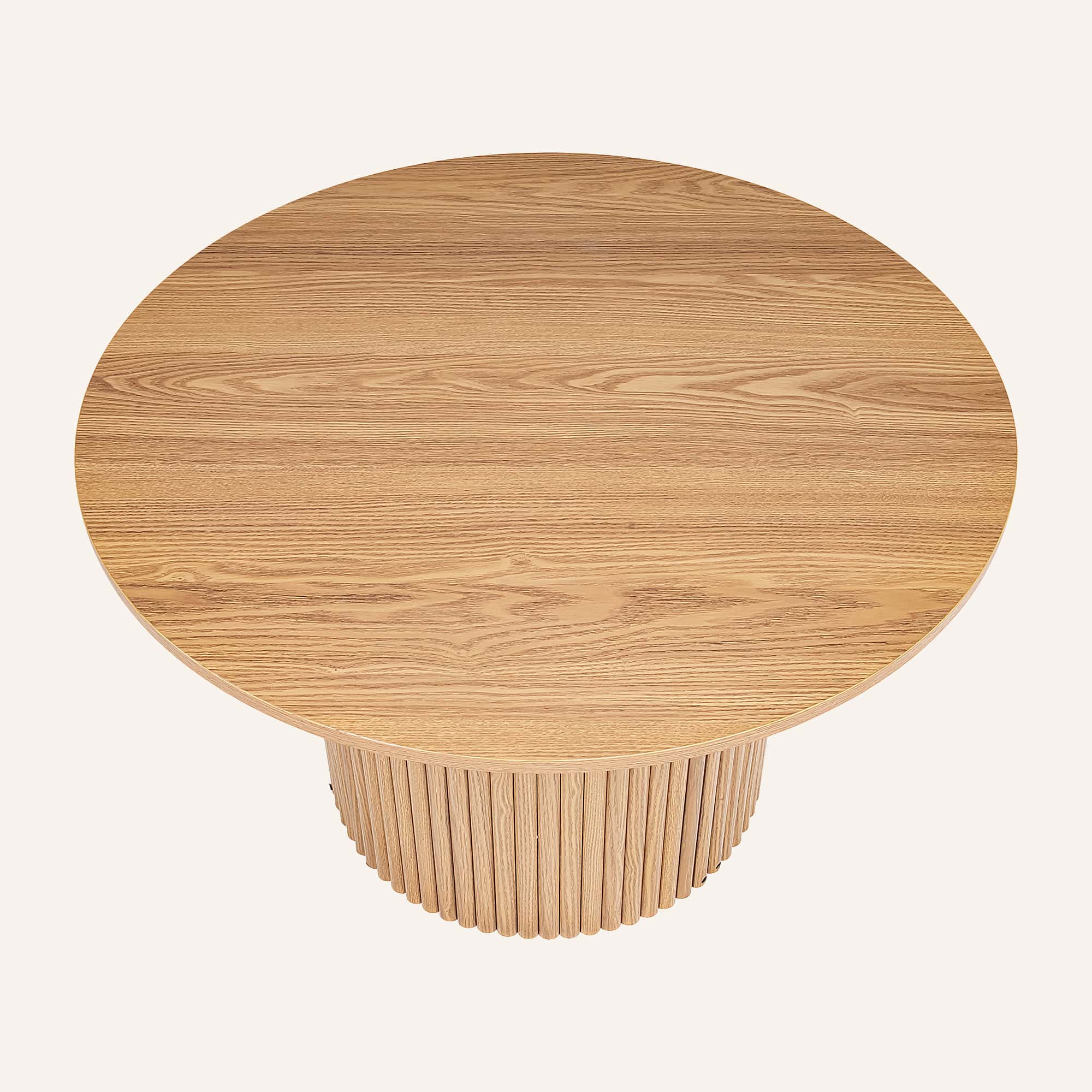 Luxe wooden round coffee table with ribbed base from Dreamo Living.