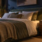 Modern bedroom with stylish decor and ambient lighting for relaxation.