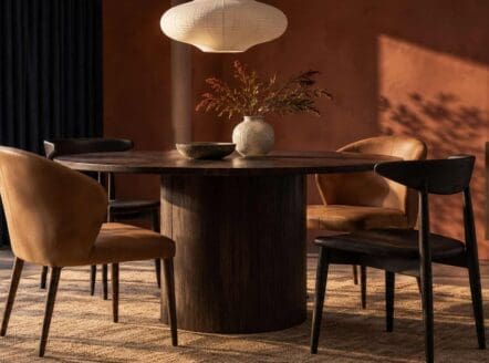 Elegant dining room with stylish chairs and warm lighting at Dreamo Living.