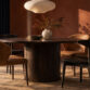 Elegant dining room with stylish chairs and warm lighting at Dreamo Living.