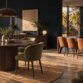 Elegant dining room with large windows and stylish furniture.